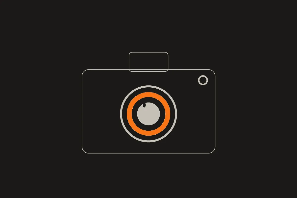 Illustration of a camera with an orange aperture ring