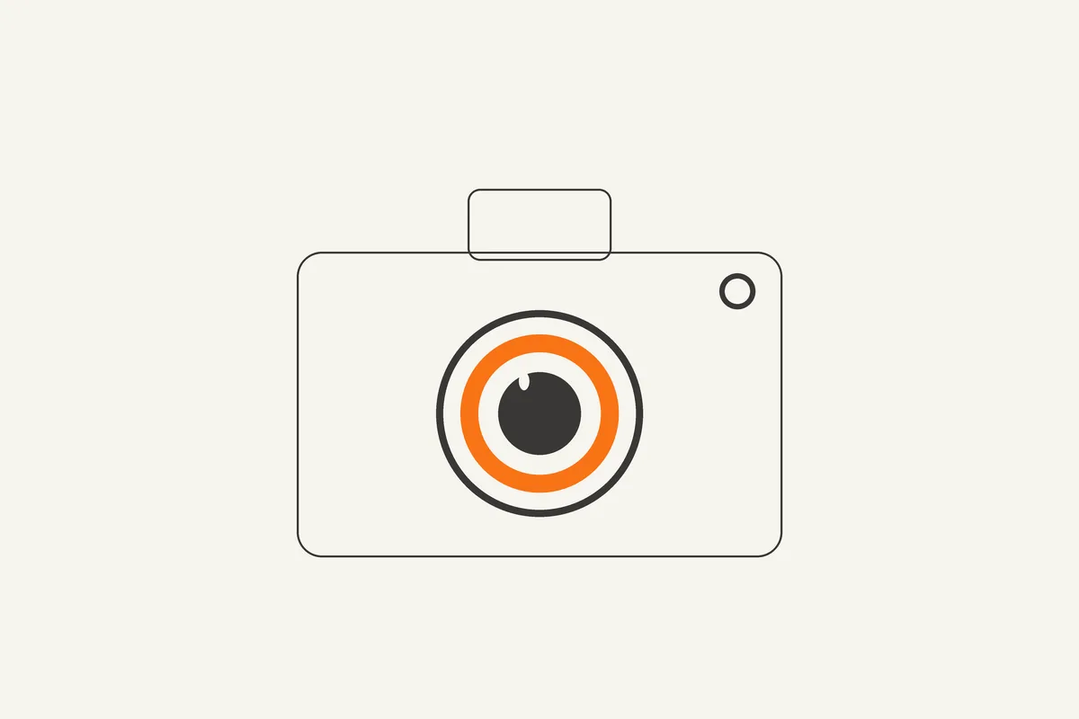 Illustration of a camera with an orange aperture ring
