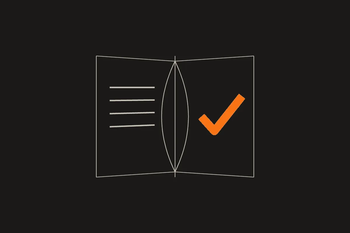 Illustration of an open book with an orange checkmark on the right page