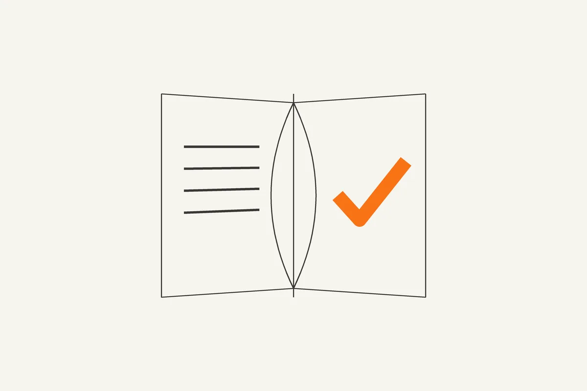 Illustration of an open book with an orange checkmark on the right page